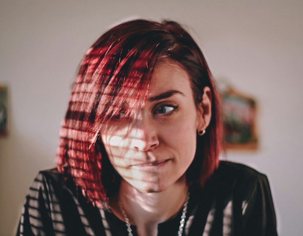 Woman lost in thought by a window